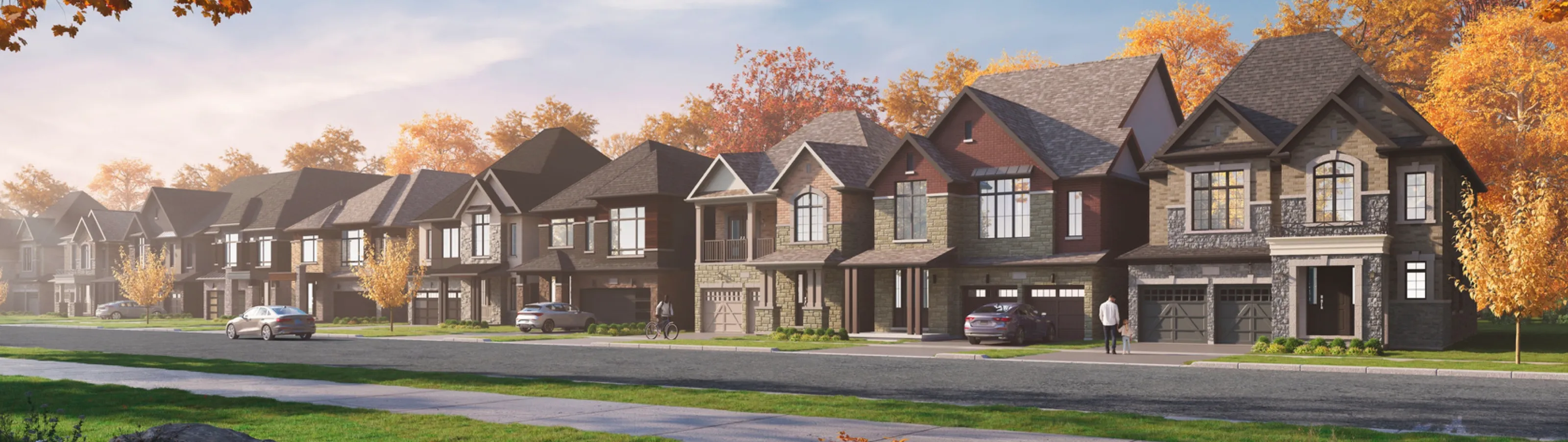 Artist's rendering of a tree-lined street of new detached homes and townhomes at Founders Walk in autumn light